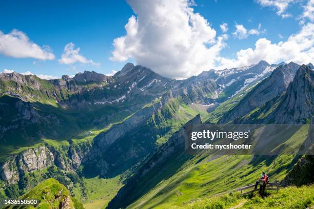 young couple enjoy majestic view of the swiss alps - appenzell innerrhoden stock pictures, royalty-free photos & images