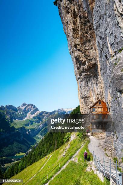 famous swiss alps gasthaus aescher -wildkirchli - appenzell innerrhoden stock pictures, royalty-free photos & images