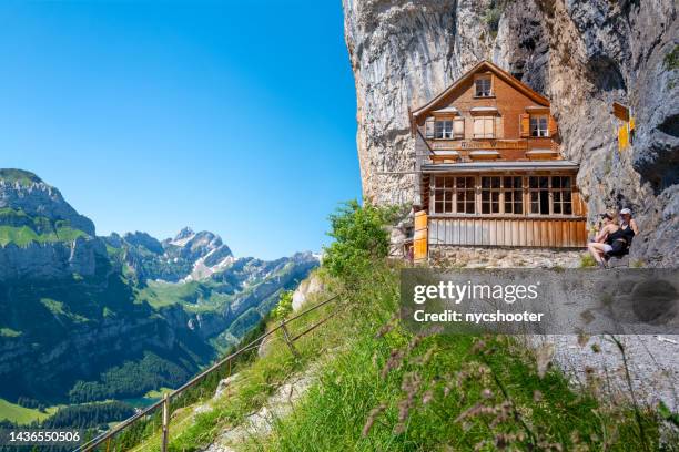 famous swiss alps gasthaus aescher -wildkirchli - appenzell innerrhoden stock pictures, royalty-free photos & images