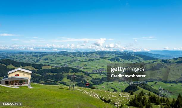 cable car climbs to the top of ebenalp station in the appenzell area of switzerland - appenzell innerrhoden stock pictures, royalty-free photos & images