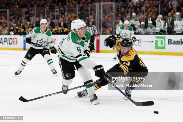 Nils Lundkvist of the Dallas Stars takes a shot against Charlie Coyle of the Boston Bruins during the second period at TD Garden on October 25, 2022...