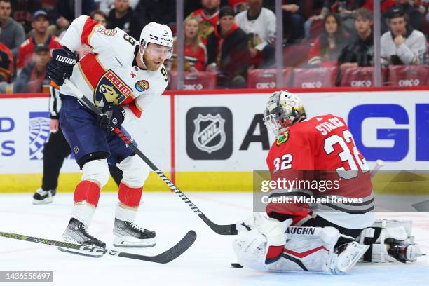 Sam Bennett of the Florida Panthers takes a shot on goal, saved by Alex Stalock of the Chicago Blackhawks during the first period at United Center on...