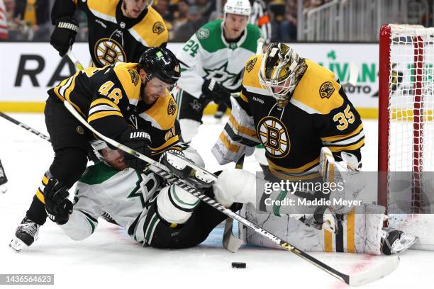 Matt Grzelcyk of the Boston Bruins collides with Joe Pavelski of the Dallas Stars in front of Linus Ullmark during the second period at TD Garden on...