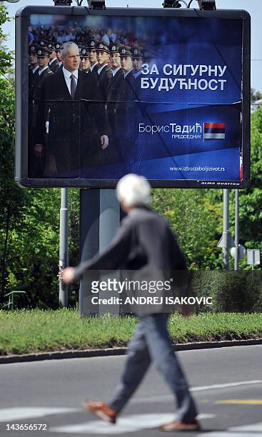 By Aleksandra Niksic A man walks past a pre-election billboard showing Serbia's incumbent President Boris Tadic and leader of the Democratic Party on...