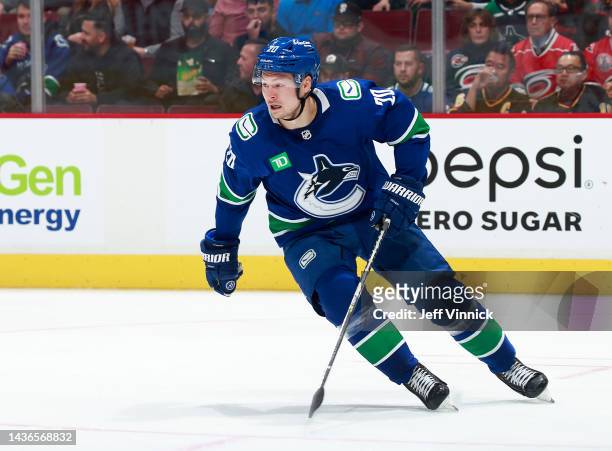 Curtis Lazar of the Vancouver Canucks skates up ice during their NHL game against the Carolina Hurricanes at Rogers Arena October 24, 2022 in...
