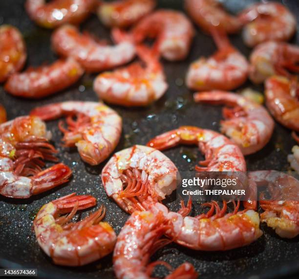 shrimps cooking on non stick pan - scampi stock pictures, royalty-free photos & images