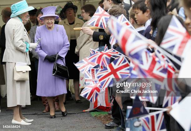 Queen Elizabeth II is cheered by crowds as she arrives at Nine Springs Park on May 2, 2012 in Yeovil, England. The Queen and Duke of Edinburgh are...