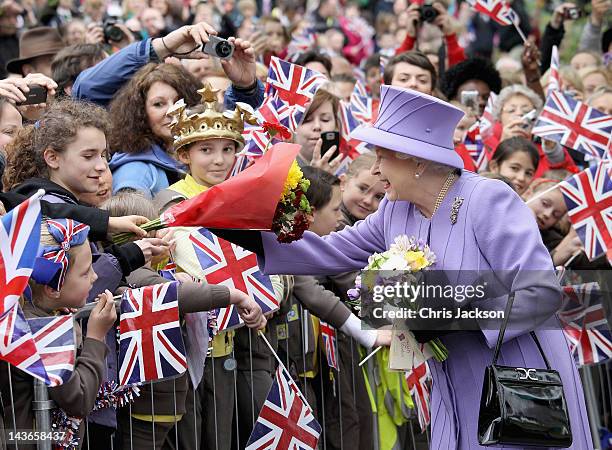 Queen Elizabeth II is cheered by crowds as she arrives at Nine Springs Park on May 2, 2012 in Yeovil, England. The Queen and Duke of Edinburgh are...