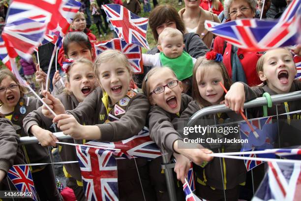Girls from the Holy Trinity Yeovil Brownies Hamdon Division cheer the arrival of the Queen on May 2, 2012 in Yeovil, England. The Queen and Duke of...