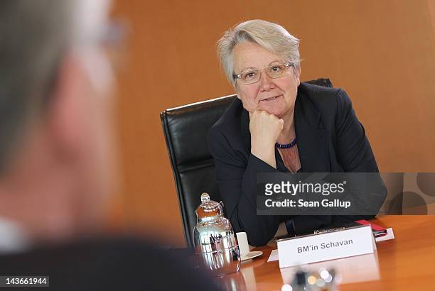 German Education Minister Annette Schavan chats with a colleague prior to the weekly German government cabinet meeting on May 2, 2012 in Berlin,...