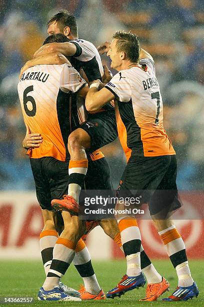 Thomas Broich of the Roar celebrates his goal against FC Tokyo with his team-mates during the AFC Asian Champions League Group F match between FC...