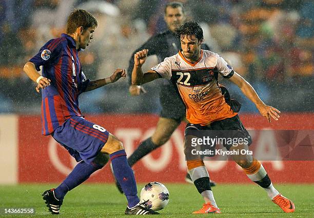 Thomas Broich of the Roar controls the ball against Aria Jasuru Hasegawa of FC Tokyo during the AFC Asian Champions League Group F match between FC...
