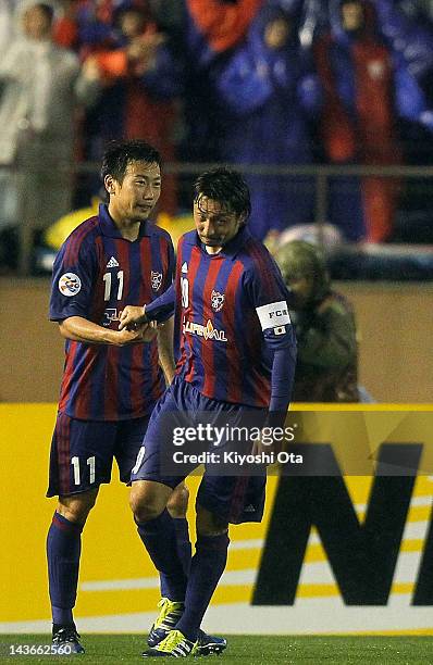 Kazuma Watanabe of FC Tokyo celebrates with his team-mate Yohei Kajiyama after scoring against Brisbane Roar during the AFC Asian Champions League...