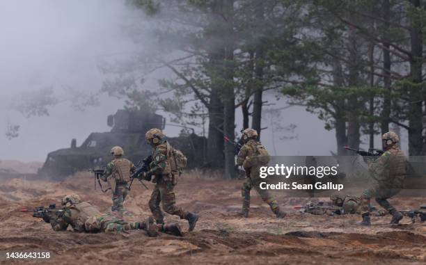 Belgian troops participate in the NATO Iron Wolf military exercises on October 26, 2022 in Pabrade, Lithuania. NATO maintains a contingent of troops...