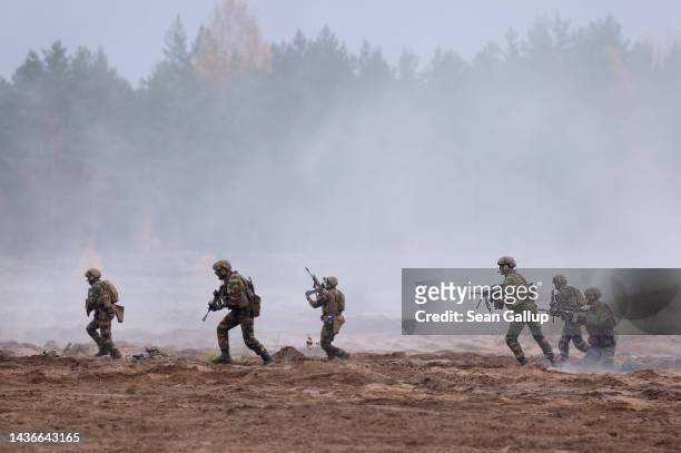 Belgian troops participate in the NATO Iron Wolf military exercises on October 26, 2022 in Pabrade, Lithuania. NATO maintains a contingent of troops...