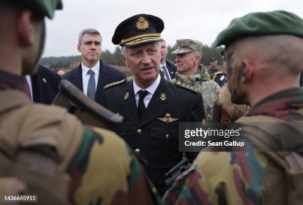 King Philippe of Belgium chats with Belgian troops participating in the NATO Iron Wolf military exercises on October 26, 2022 in Pabrade, Lithuania....