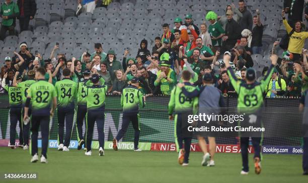 Irish players celebrate with fans after Ireland defeated England during the ICC Men's T20 World Cup match between England and Ireland at Melbourne...