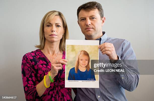 Parents of missing girl Madeleine McCann, Kate and Gerry McCann pose with an artist's impression of how their daughter might look now at the age of...