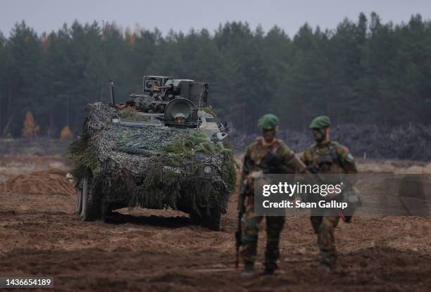 Belgian troops with a Piranha DF30 armoured personnel carrier participate in the NATO Iron Wolf military exercises on October 26, 2022 in Pabrade,...