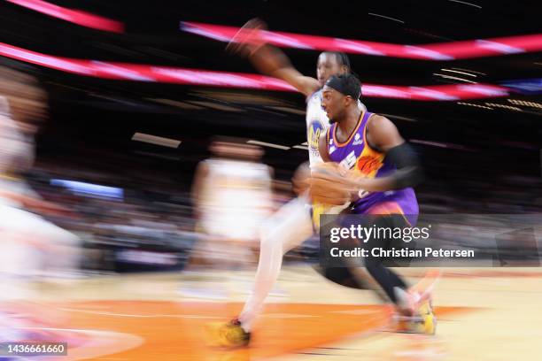 Josh Okogie of the Phoenix Suns drives to the basket during the second half of the NBA game against the Golden State Warriors at Footprint Center on...