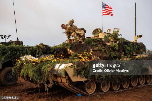 Enhanced Forward Presence Battalion Mechanised Infantry Brigade “Iron Wolf” troops fly the flag during a static display of Rifle Platoon attack by...