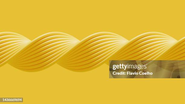 yellow background with twisted tubes pattern - twisted foto e immagini stock