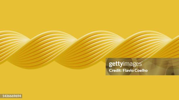 yellow background with twisted tubes pattern - contorcido - fotografias e filmes do acervo