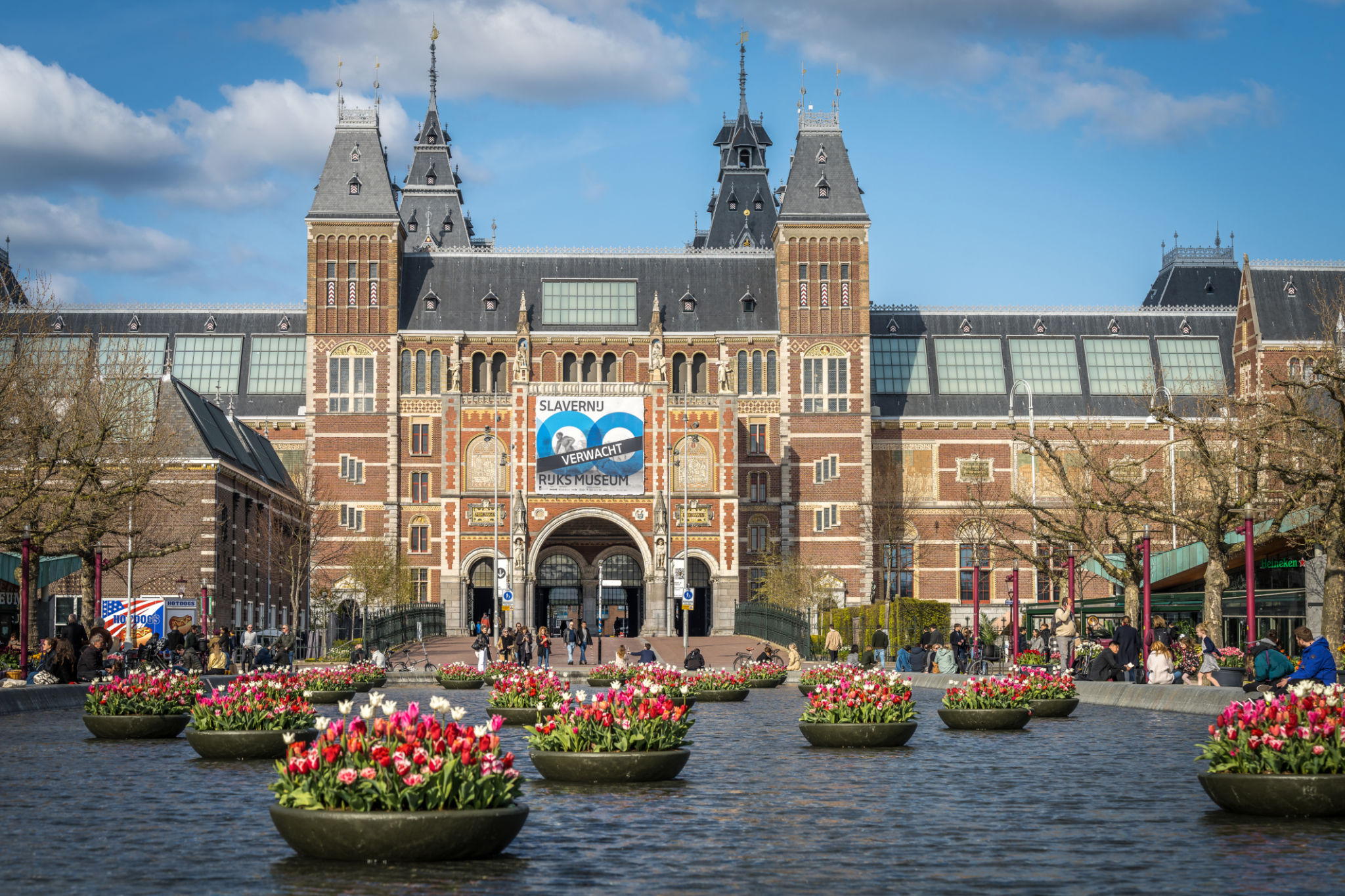 Closeup of the Rijksmuseum in Amsterdam with tulips in summer Closeup of the Rijksmuseum in Amsterdam with tulips in summer