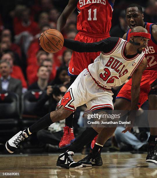 Richard Hamilton of the Chicago Bulls drives against Elton Brand of the Philadelphia 76ers in Game Two of the Eastern Conference Quarterfinals during...