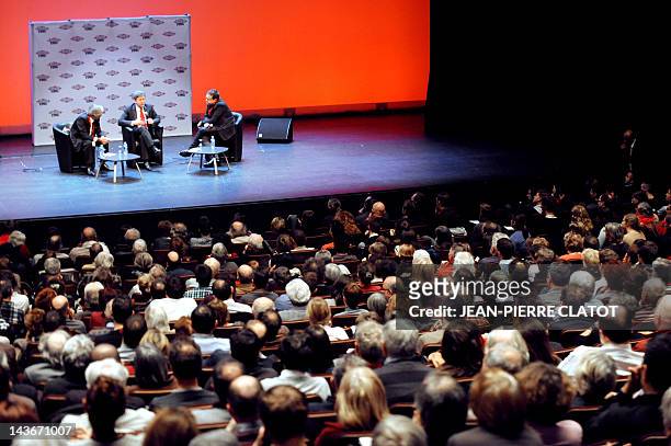 Left Front party's candidate for 2012 French presidential election, Jean-Luc Melenchon , speaks with French daily newspaper Liberation chief editor...