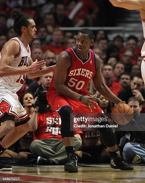 Lavoy Allen of the Philadelphia 76ers moves against Joakim Noah of the Chicago Bulls in Game Two of the Eastern Conference Quarterfinals during the...