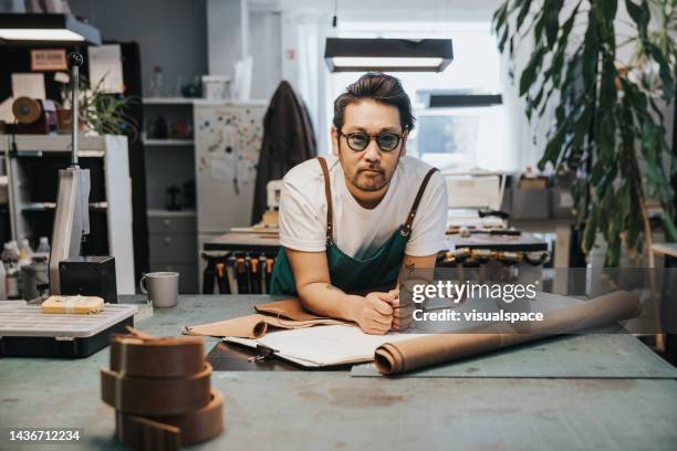 japanese designer in his leathercraft studio - cool man leather stock pictures, royalty-free photos & images