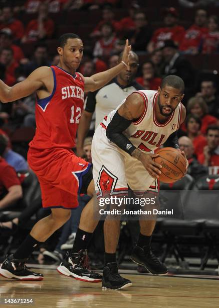 Watson of the Chicago Bulls moves past Evan Turner of the Philadelphia 76ers in Game Two of the Eastern Conference Quarterfinals during the 2012 NBA...