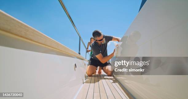 yacht cabin crew cleaning yacht - yacht bildbanksfoton och bilder