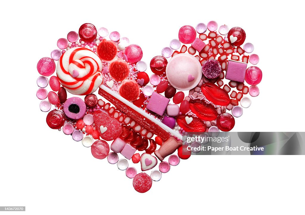 Red and pink food heart made out of candy & sweets