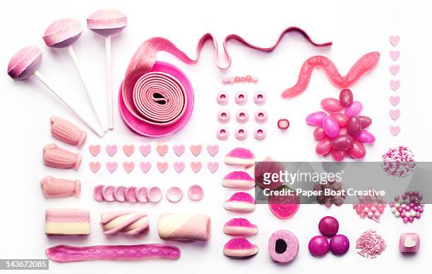 graphic layout made out of pink candies and sweets - bubble gum stock pictures, royalty-free photos & images