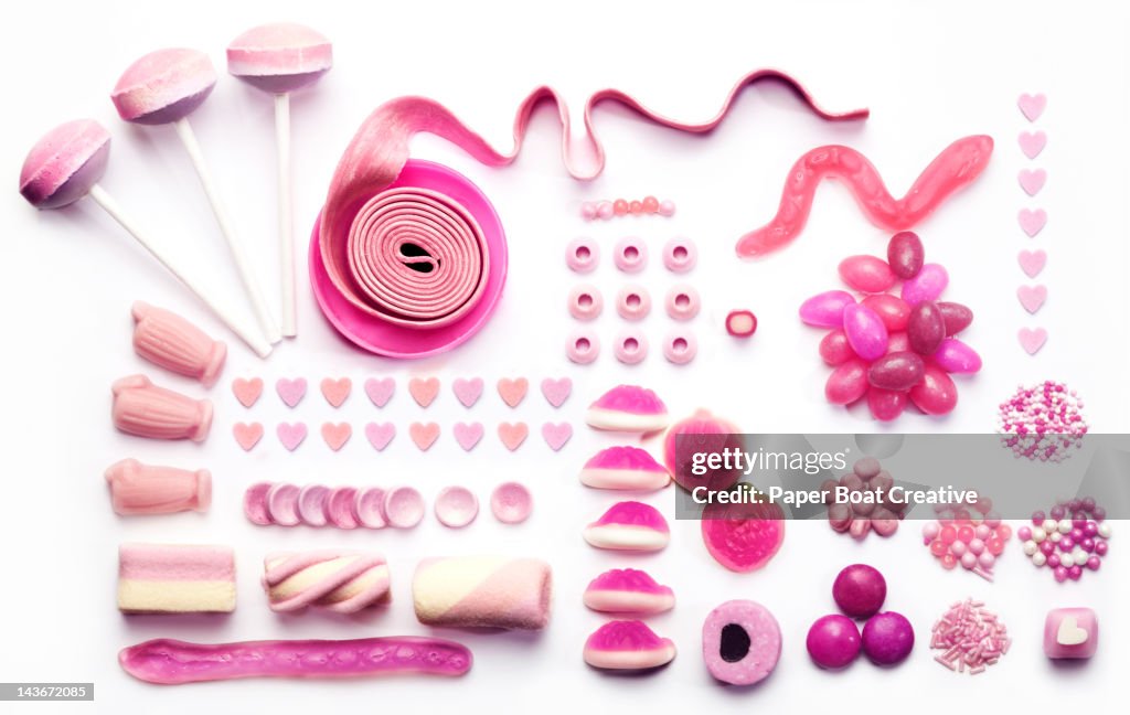 Graphic layout made out of pink candies and sweets