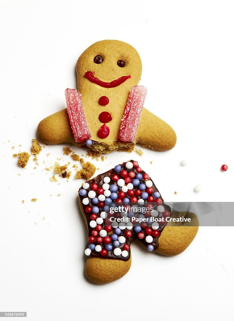 Ginderbread Man Exploding A Gingerbread Man Broken In Half High-Res Stock Photo - Getty Images