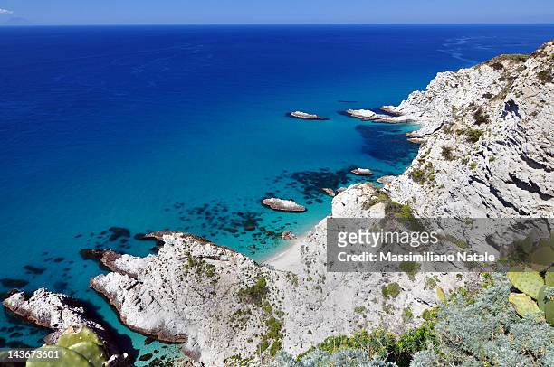 coast of tropea blue sea with still rocks - calabria stock pictures, royalty-free photos & images