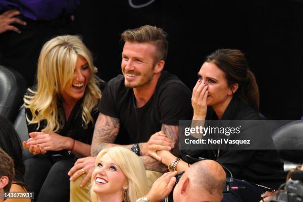 David Beckham and Victoria Beckham attend a basketball game between the Denver Nuggets and the Los Angeles Lakers at Staples Center on May 1, 2012 in...