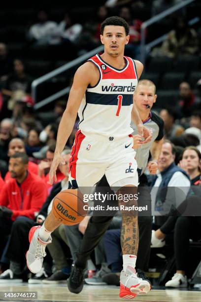 Johnny Davis of the Washington Wizards dribbles against the Detroit Pistons during the second half at Capital One Arena on October 25, 2022 in...