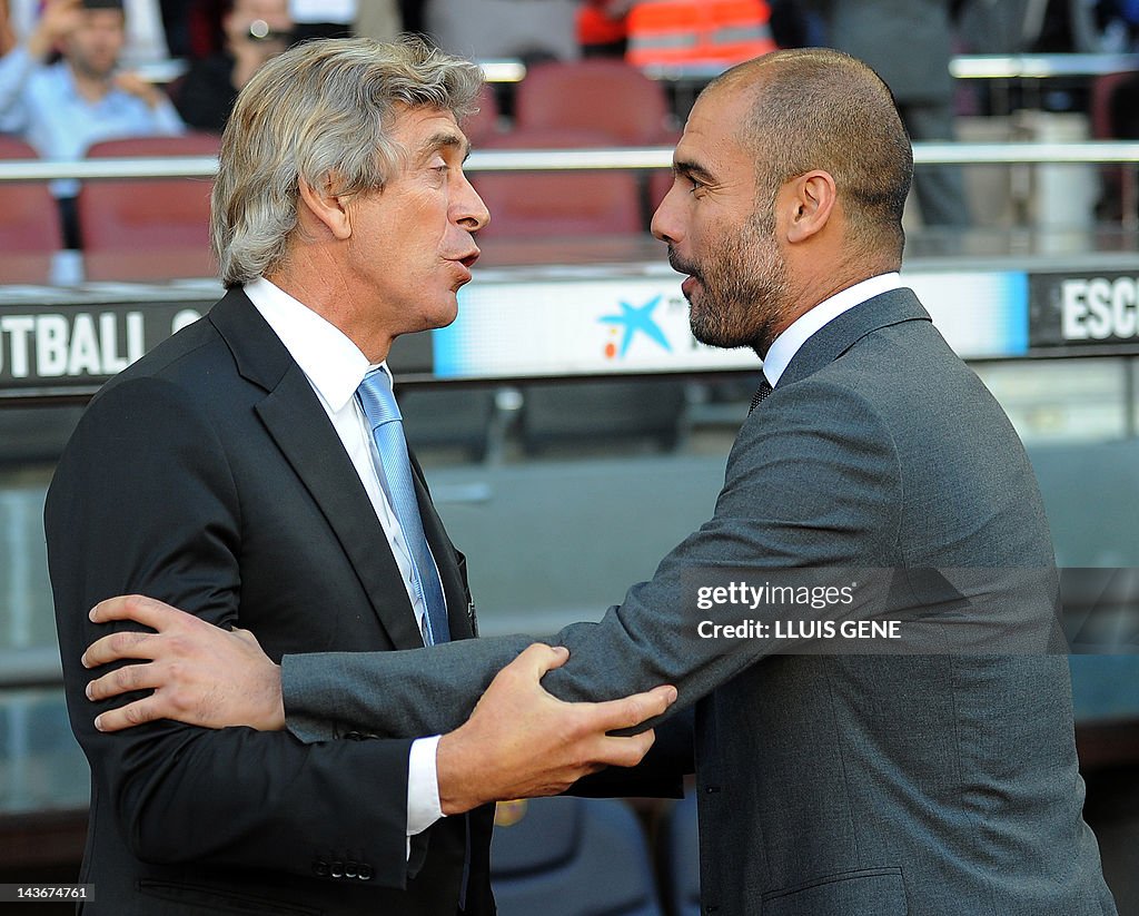 Barcelona's coach Josep Guardiola (R) ta