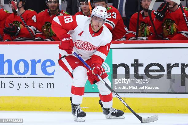 Andrew Copp of the Detroit Red Wings skates with the puck against the Chicago Blackhawks during the third period at United Center on October 21, 2022...