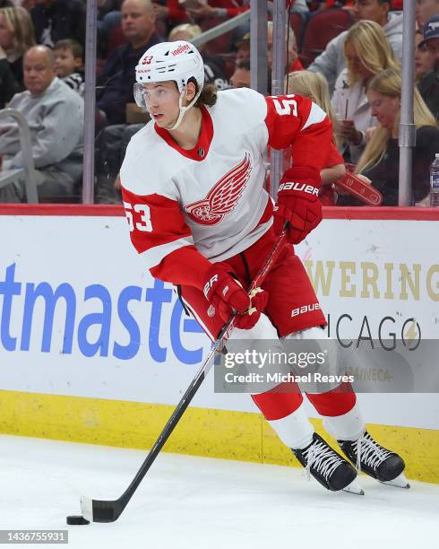 Moritz Seider of the Detroit Red Wings skates with the puck against the Chicago Blackhawks during the second period at United Center on October 21,...