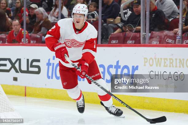 Olli Maatta of the Detroit Red Wings skates with the puck against the Chicago Blackhawks during the second period at United Center on October 21,...