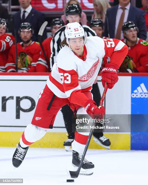 Moritz Seider of the Detroit Red Wings skates with the puck against the Chicago Blackhawks during the first period at United Center on October 21,...