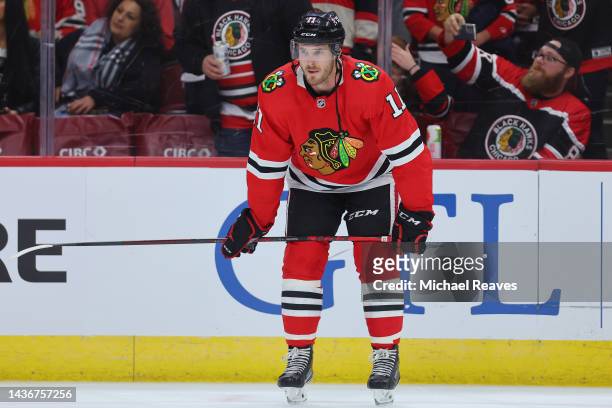 Taylor Raddysh of the Chicago Blackhawks looks on against the Detroit Red Wings prior to the game at United Center on October 21, 2022 in Chicago,...