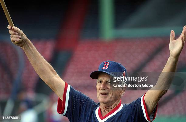 Red Sox coach Johnny Pesky hits fungoes to Manny Ramirez before the Red Sox and Indians game.