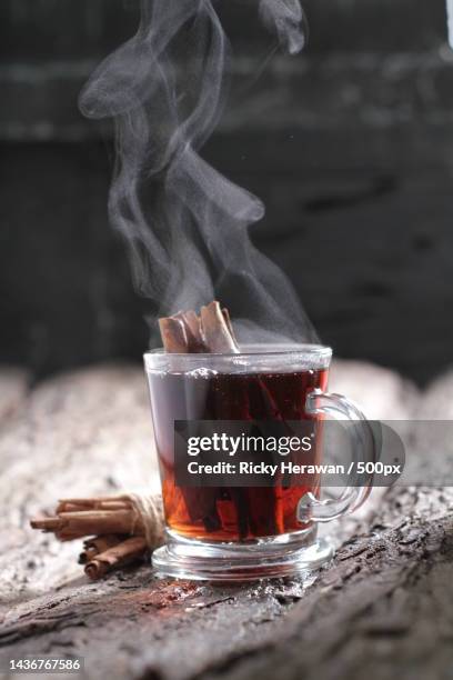 close-up of tea in cup on table,bekasi,indonesia - punsch tasse stock-fotos und bilder