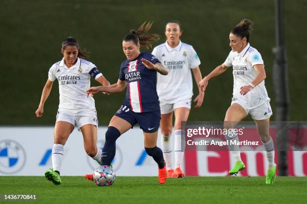 Ramona Bachmann of Real Madrid CF is challenged by Kenti Robles of Paris Saint-Germain during the UEFA Women's Champions League group A match between...